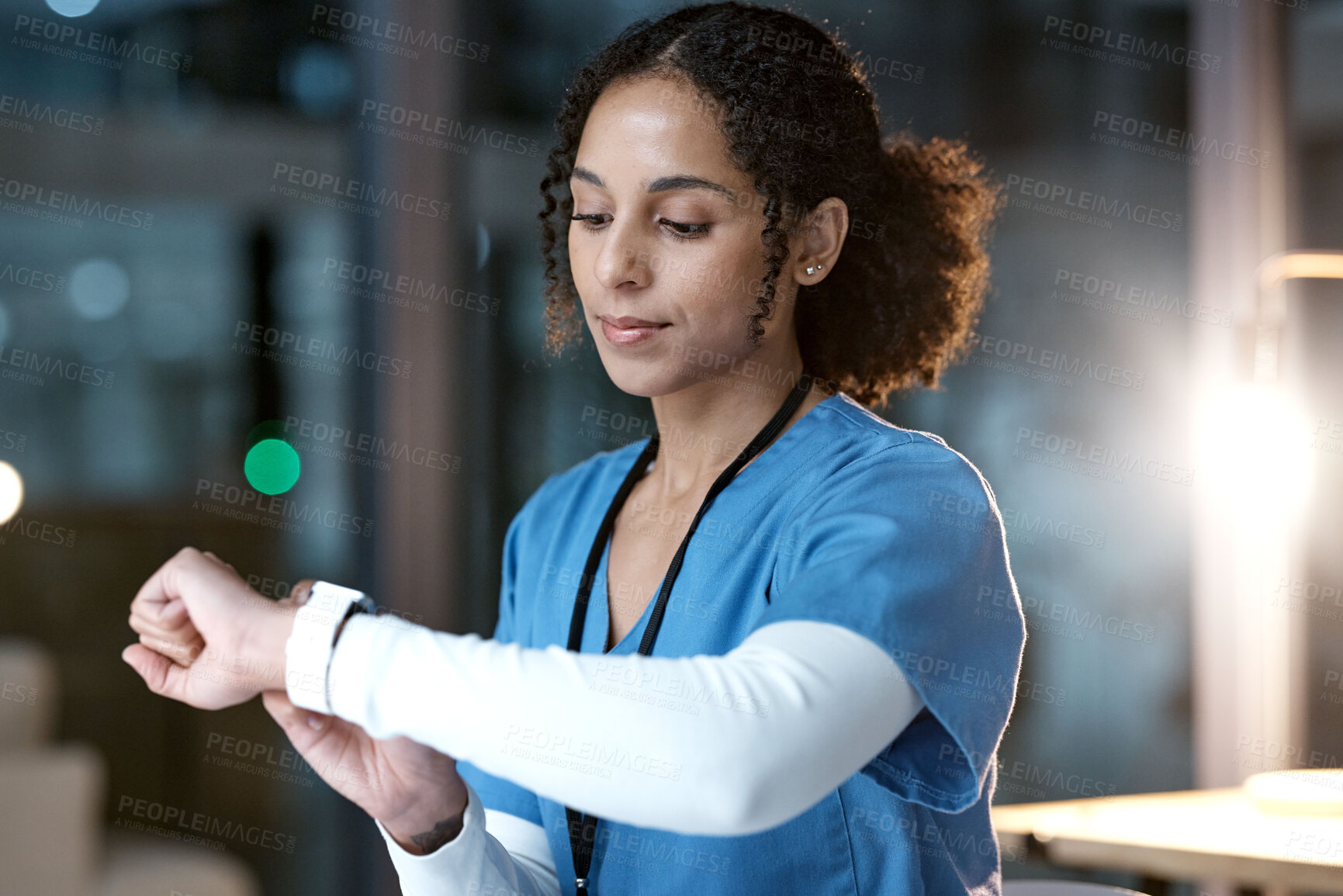 Buy stock photo Doctor, woman and wristwatch at night in clinic office for personal health, wellness or time. Medical expert reading, iot tech or smartwatch to monitor healthcare for blood pressure in dark hospital