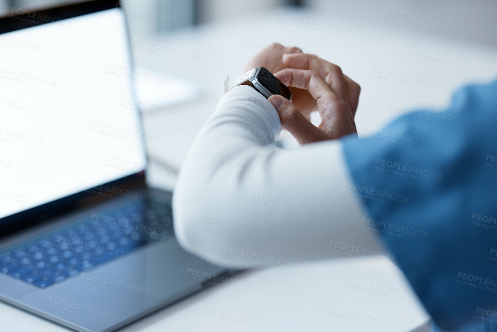 Buy stock photo Watch, healthcare and time with a woman nurse working late at night on a laptop in the hospital. Medical, smartwatch and overtime with a female medicine professional at work on a computer in a clinic