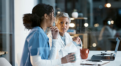 Buy stock photo Doctor, team and laptop in discussion at night for healthcare strategy or planning at hospital. Women medical professional in collaboration working late together for teamwork, conversation or ideas