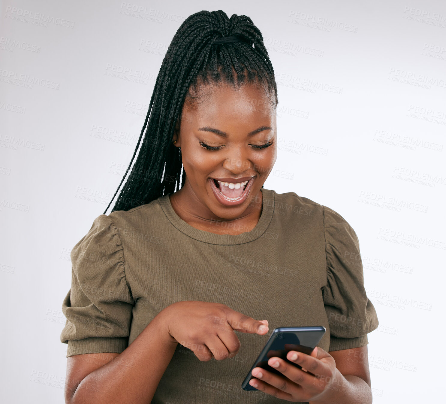 Buy stock photo Phone, funny and woman laughing in a studio while watching a video on social media or the internet. Happy, smile and African female looking at a meme on her cellphone isolated by a white background.