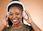 Headphones, face and music black woman isolated on studio background for gen z streaming, radio and smile. Happy portrait, person listening to audio for beauty podcast, youth confidence and mockup