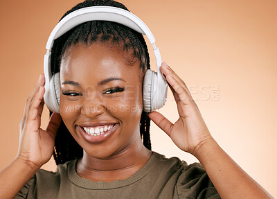 Buy stock photo Headphones, face and music black woman isolated on studio background for gen z streaming, radio and smile. Happy portrait, person listening to audio for beauty podcast, youth confidence and mockup