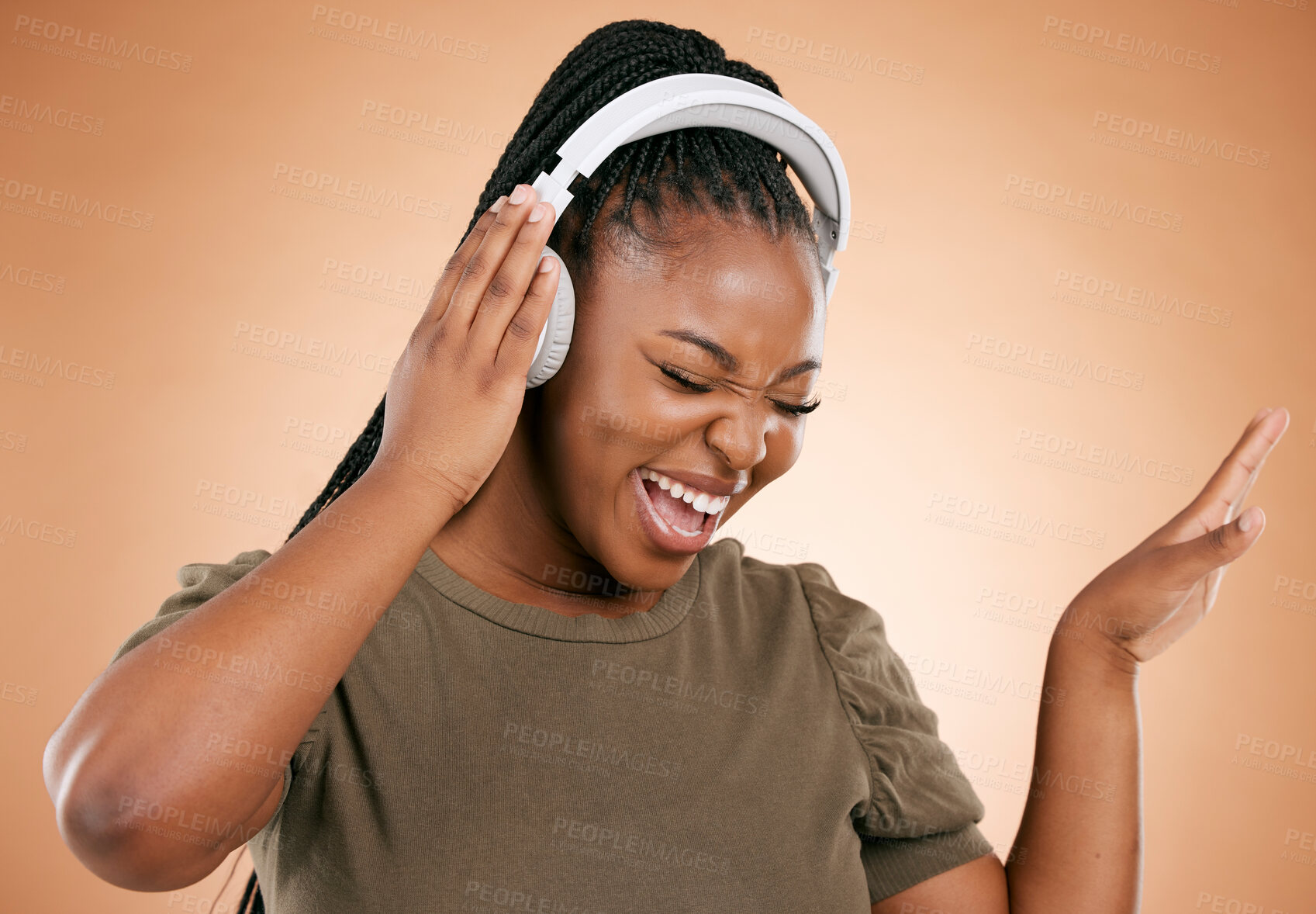 Buy stock photo Headphones, singing and black woman isolated on studio background for mental health, energy and radio music. Singer, voice and gen z african person listening to audio technology with mockup space