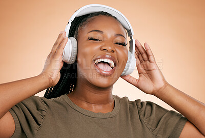 Buy stock photo Headphones, singing and portrait of woman isolated on studio background in mental health, energy and radio music. Singer, voice and gen z black people listening to sound, audio technology on mockup