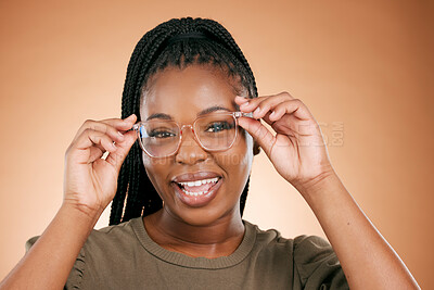 Buy stock photo Black woman, portrait smile and glasses for fashion, style or smart casual against a studio background. Happy African American female model face smiling for eyewear, spectacles and sight or vision