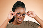 Black woman, hands and face with smart glasses for casual fashion or style against studio background. Portrait of happy African American female with smile for eyewear, spectacles and sight or vision