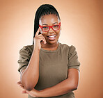 Portrait, glasses or black woman with smile, leadership or confident girl on brown studio background. Face, African American female or happy lady with eyewear, comfortable or smart person on backdrop