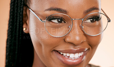 Buy stock photo Black woman, face zoom and smile with glasses, vision and prescription lens isolated on studio background. Eyewear, eye care and healthcare for eyes, happy girl with fashion frame and optometry