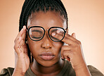 Black woman with glasses, tired and rubbing eyes, burnout and stress isolated on studio background. Vision, eye sight and overworked or exhausted person with spectacles, hands on face from allergy.