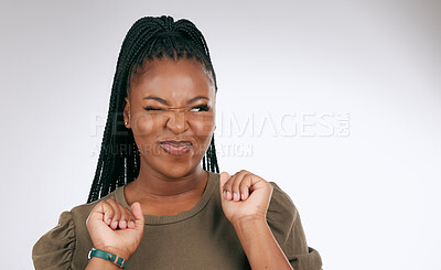 Buy stock photo Silly, happy and black woman face with sassy emoji attitude facial expression in studio. White background, isolated and young model with fashion fashion with comic, crazy and goofy gesture alone