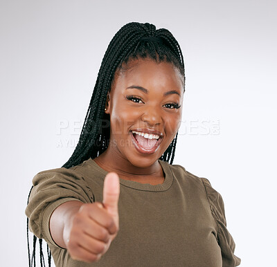 Buy stock photo Black woman, portrait smile and thumbs up for winning, discount or deal isolated on a grey studio background. Happy African American female face smiling showing thumbsup hand gesture for good job