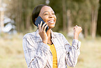 African woman, celebrate and fist with phone call, outdoor or smile for winning, success or goal in summer. Adventure, smartphone conversation or good news for girl in sunshine, forest or celebration