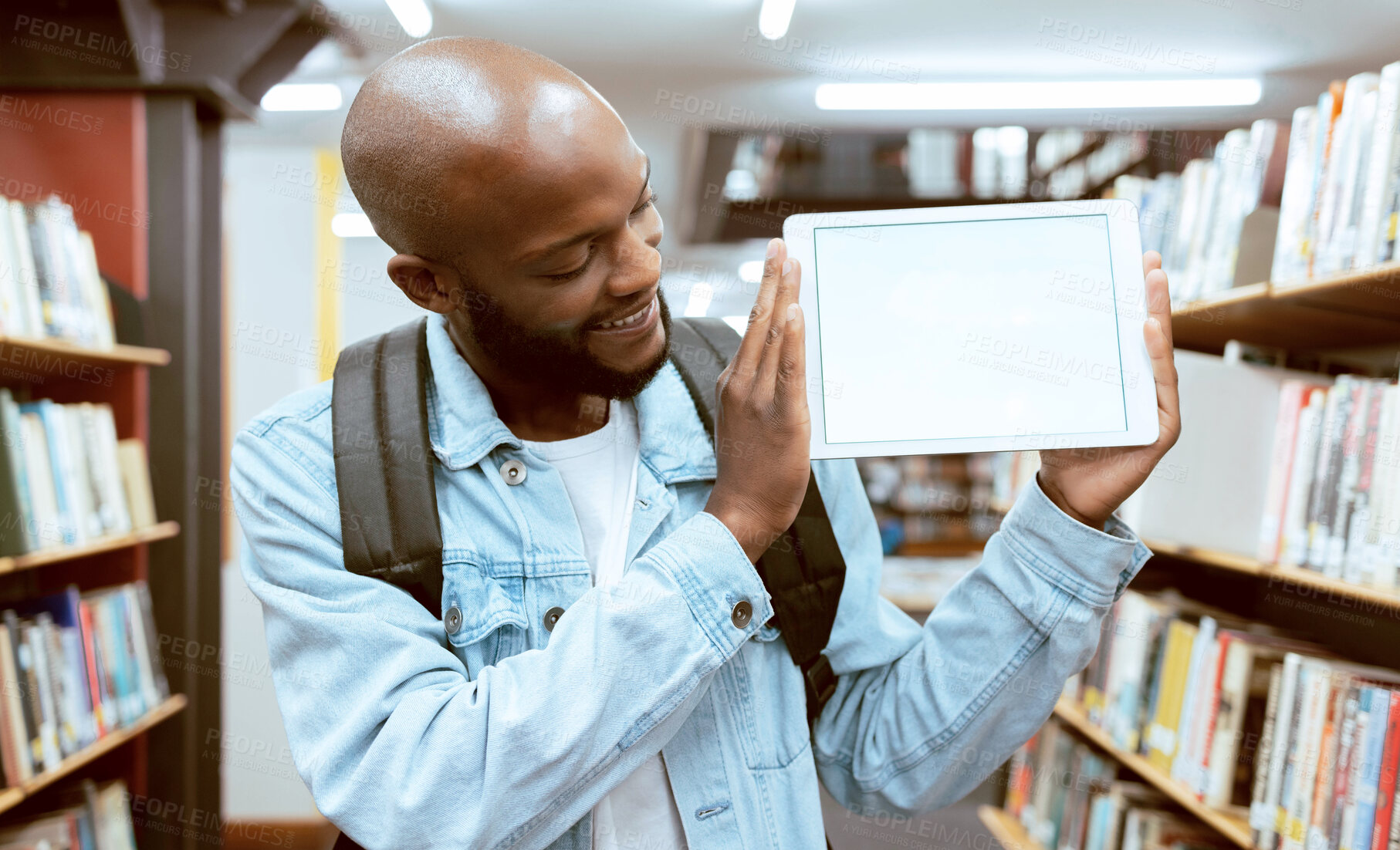 Buy stock photo Mock up, student or black man on tablet screen for advertising, scholarship results or research review in library. Education, school or male with tech in university for internet, website or learning