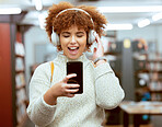 Headphones, phone and woman in the library with music, radio or podcast for study motivation. Happy, excited and female college student from Brazil listening to song, album or playlist in book store.