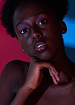 Cool, aesthetic and portrait of black woman in dark color lighting isolated on a studio background. Neon, art and face of an African girl with creativity, makeup and stylish on a creative backdrop