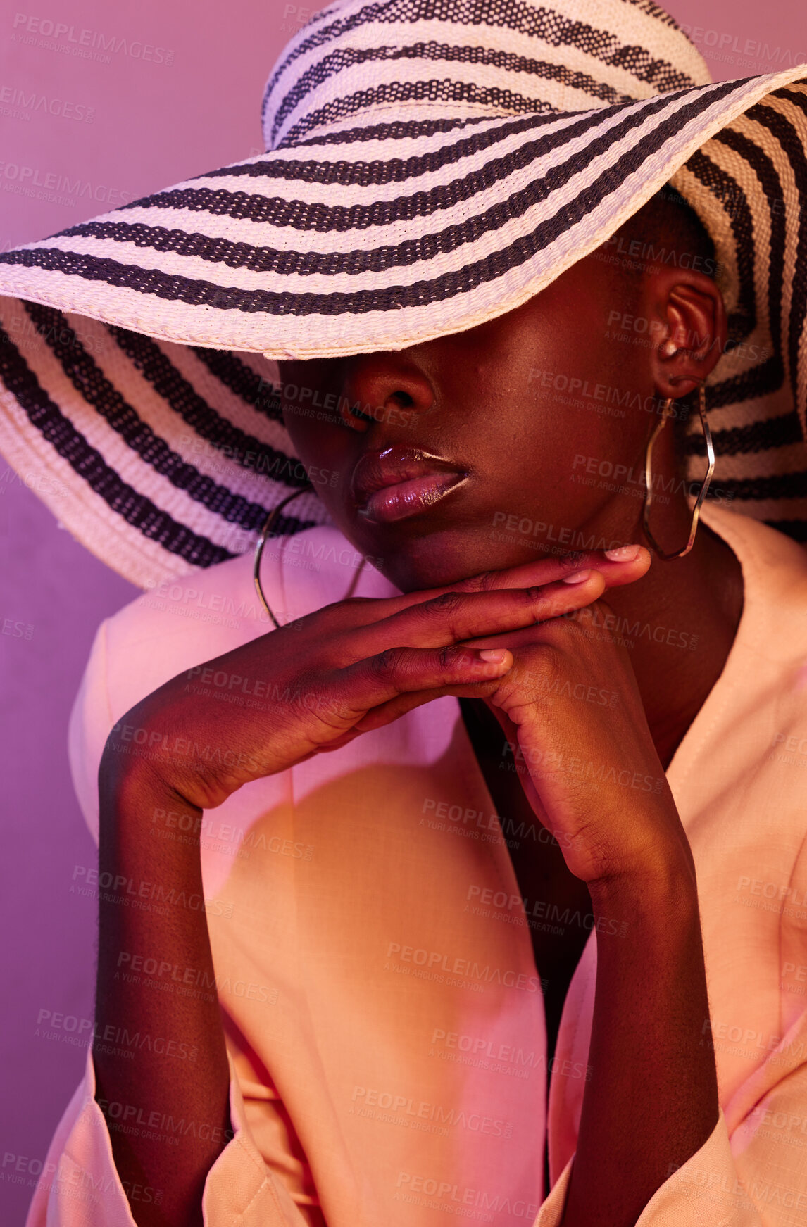 Buy stock photo Fashion, sun hat and black woman in a studio with neon light for aesthetic with beauty and trend. Stylish summer accessory, UV and young African female model with style by a purple background.