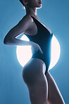 Sexy, erotic and body of a woman with a spotlight isolated on a dark background in a studio. Fashion, curves and butt of a model posing for sensuality, seductive and stylish energy on a backdrop