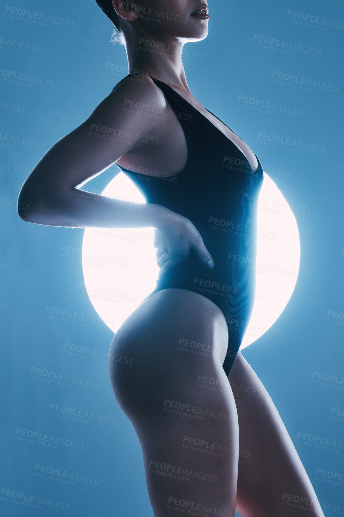 Buy stock photo Sexy, erotic and body of a woman with a spotlight isolated on a dark background in a studio. Fashion, curves and butt of a model posing for sensuality, seductive and stylish energy on a backdrop