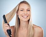 Hair straightener, face portrait and beauty of woman in studio isolated on gray background. Balayage, haircare and happy female model with flat iron product for hairstyle, grooming or salon treatment