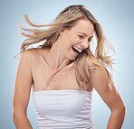 Hair, beauty and woman in studio smile, dance and head shake fun on grey background mockup space. Haircare, girl and model relax with luxury, wellness and grooming, hygiene and pamper while isolated