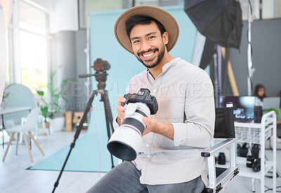 Buy stock photo Portrait, photographer and man with camera in studio, happy and smile before a photo shoot. Face, photography and asian guy relax during professional, shooting for model, design and creative career