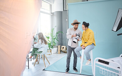 Buy stock photo Photography, camera and photographer talking to a model to choose a image from the photoshoot in the studio. Creative, art and cameraman choosing the best picture with a woman on a artistic set.