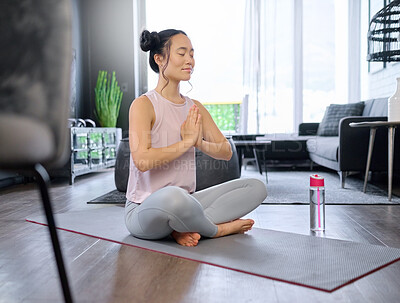 Buy stock photo Prayer hands, yoga and meditation of Asian woman in home living room for mindfulness exercise. Zen chakra, pilates and female yogi training and meditating with namaste hand pose for relax and peace.