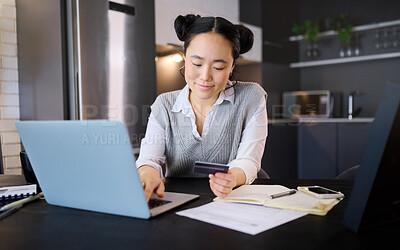 Buy stock photo Online shopping, credit card and Asian woman typing on laptop for banking or payment in home kitchen. Ecommerce, fintech and female with computer for buying, paying bills or finance budget at night.