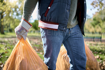 Buy stock photo Trash, volunteer hands and man cleaning garbage, pollution or waste product for environment support. Plastic bag container, NGO charity service and eco friendly person help with nature park clean up