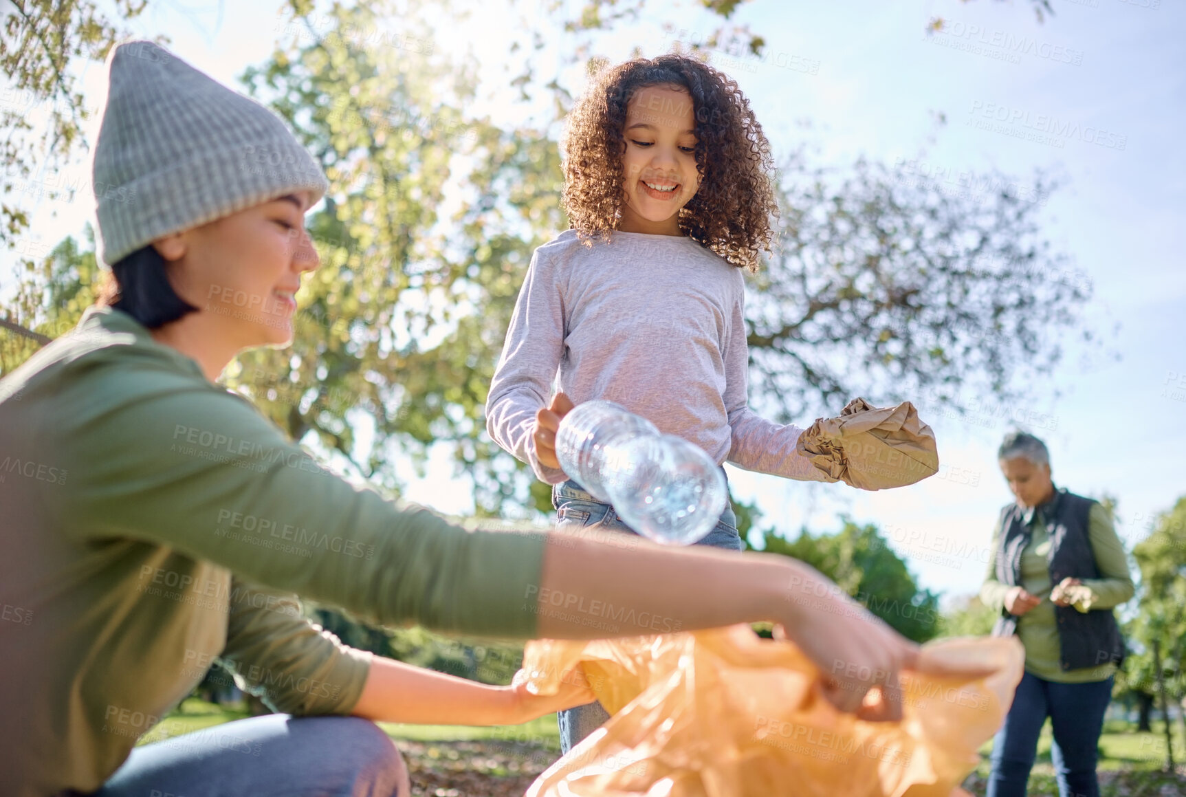 Buy stock photo Recycle plastic, bottle and people with child in park for community service, volunteering and cleaning education. Happy woman with kid in nature forest for recycling, pollution and earth day support