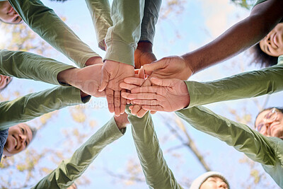 Buy stock photo Teamwork, collaboration and low angle of people with hands together for team building. Motivation, solidarity and group of men and women huddle for unity, union or community, support or cooperation.