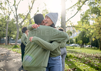 Buy stock photo Hug, friends and happy volunteer people outdoor at nature park with care for earth. Woman and man team together for community service in green ngo tshirt for recycling, cleaning and clean enviroment