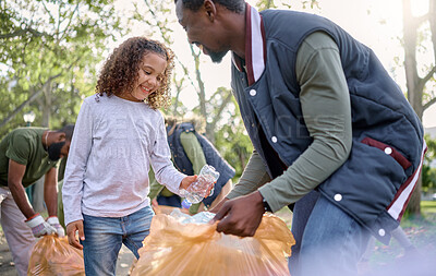 Buy stock photo Trash, volunteer man and child cleaning garbage, pollution or waste product for community environment support. Plastic bottle container, NGO charity and nature park clean up by eco friendly black kid