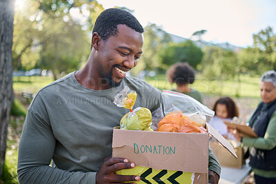 Buy stock photo Food, donation and man in park with smile and grocery box, happy, healthy diet at refugee feeding project. Fresh fruit, charity donations and help to feed people, support from farm volunteer at ngo.
