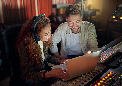 Buy stock photo Collaboration, teamwork or music recording with sound headphones, laptop or composition app in edm studio. Musician, friends or happy people on technology in night radio, audio or dj media production