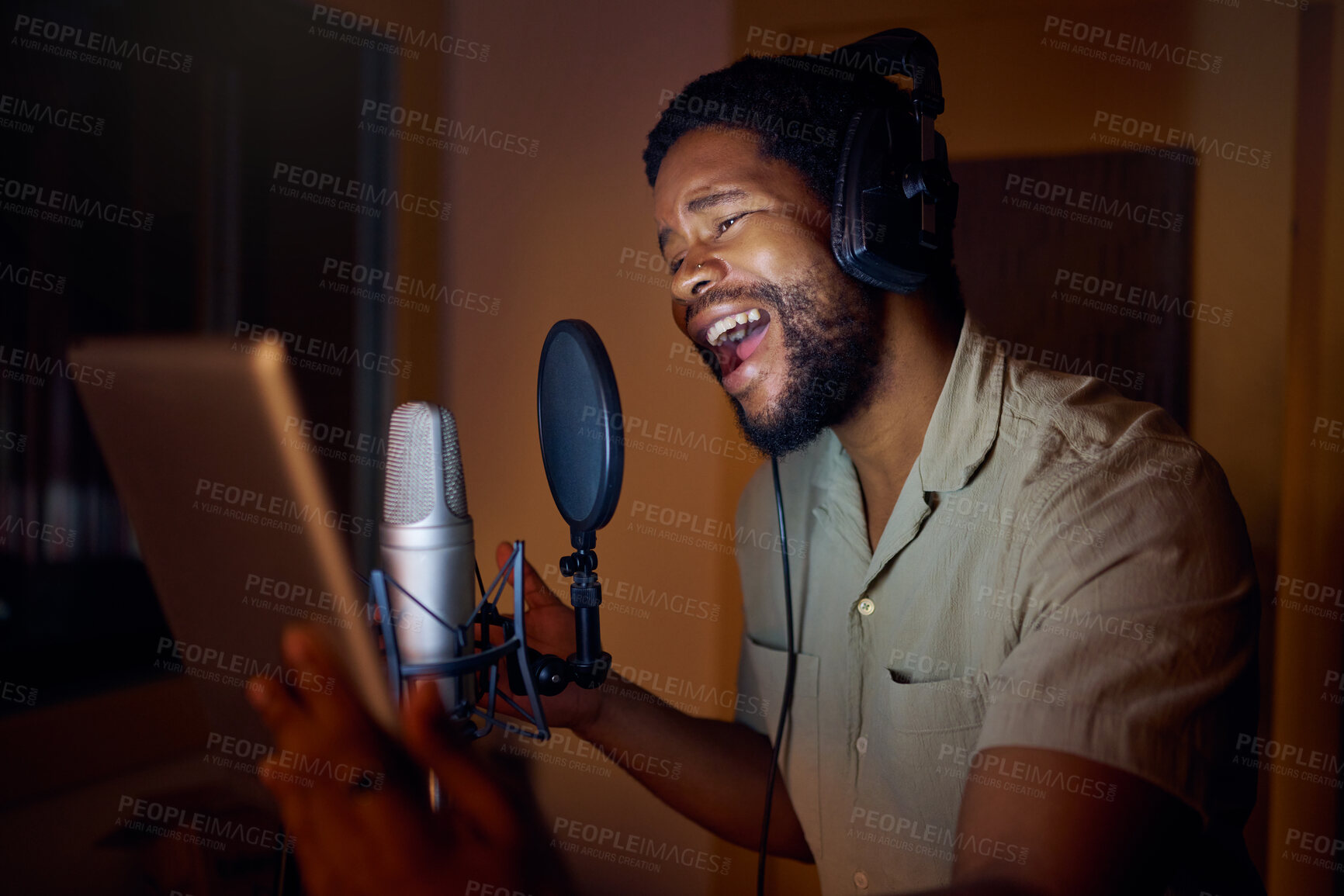 Buy stock photo Tablet, singer or black man on studio microphone, music app or live streaming lyrics in dark recording. Singing, musician or artist on technology production, voice media or sound performance practice