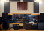 Recording studio, music and musical equipment for broadcast, radio or entertainment industry. Media, instruments and technology for a album or song production and sound track performance in a studio.
