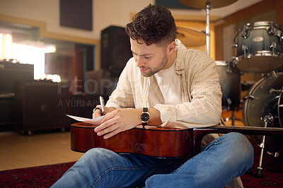 Buy stock photo Idea, artist and musician writing a song for a performance, sound and talent in the studio. Creative, planning and artist with a guitar for music production, rehearsal and guitarist with a hobby