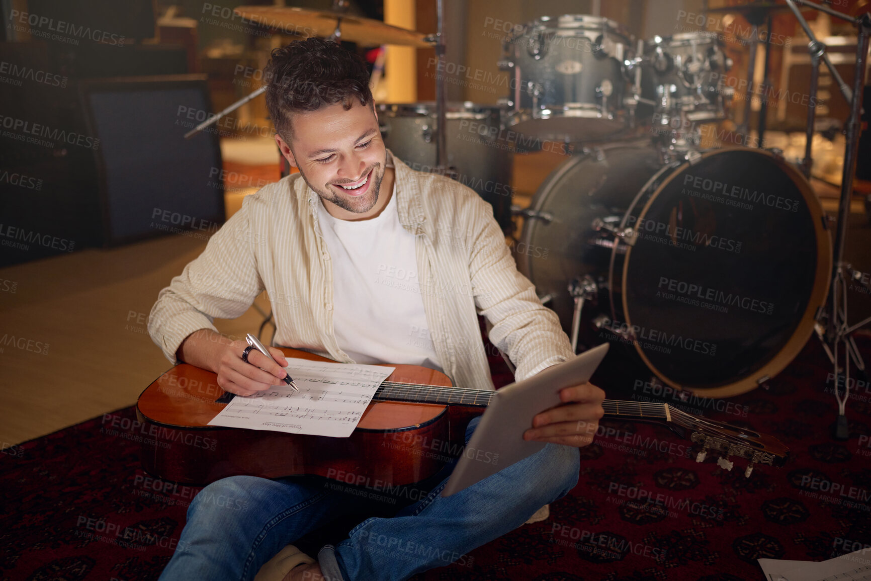 Buy stock photo Happy, tablet and musician writing a song for a performance on a video call in the studio. Creative, planning and artist with a guitar for music production with technology for a sound website