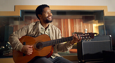 Buy stock photo Musician, acoustic and man playing the guitar for music production or recording in studio. Artist, guitarist and African guy strumming the strings of a musical instrument for sound track performance.