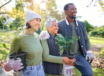 Buy stock photo Volunteer group, plants and gardening in a park with trees in nature environment, agriculture or garden. Happy man and women planting for growth, ecology and sustainability for community on Earth day