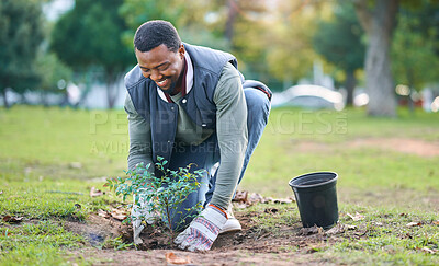 Buy stock photo Community service, volunteering and black man plant trees in park, garden and nature for sustainability. Climate change, soil gardening and agriculture for earth day, growth support and green ecology