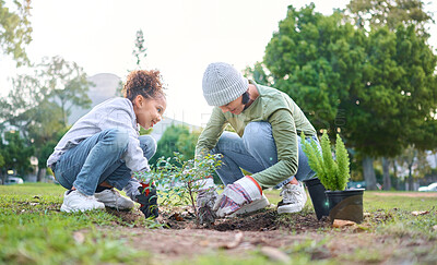 Buy stock photo Family, plant and gardening in a park with trees in nature environment, agriculture or garden. Volunteer woman and child planting for growth, ecology and sustainability for community on Earth day