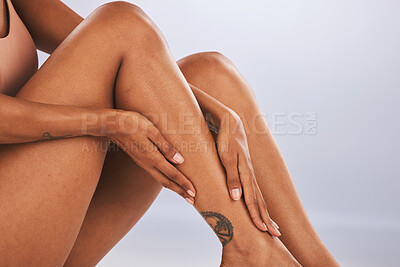 Buy stock photo Legs, hands and skin, black woman and beauty, skincare epilation and manicure isolated on studio background. Health, wellness and grooming, waxing or laser hair removal, dermatology and cosmetic care