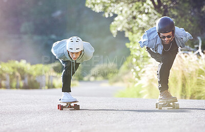 Friends, speed and couple longboard skating in road, racing downhill with skateboard and helmet for safety. Extreme sports adventure, skateboarding street race and skateboarder ride on mountain pass.