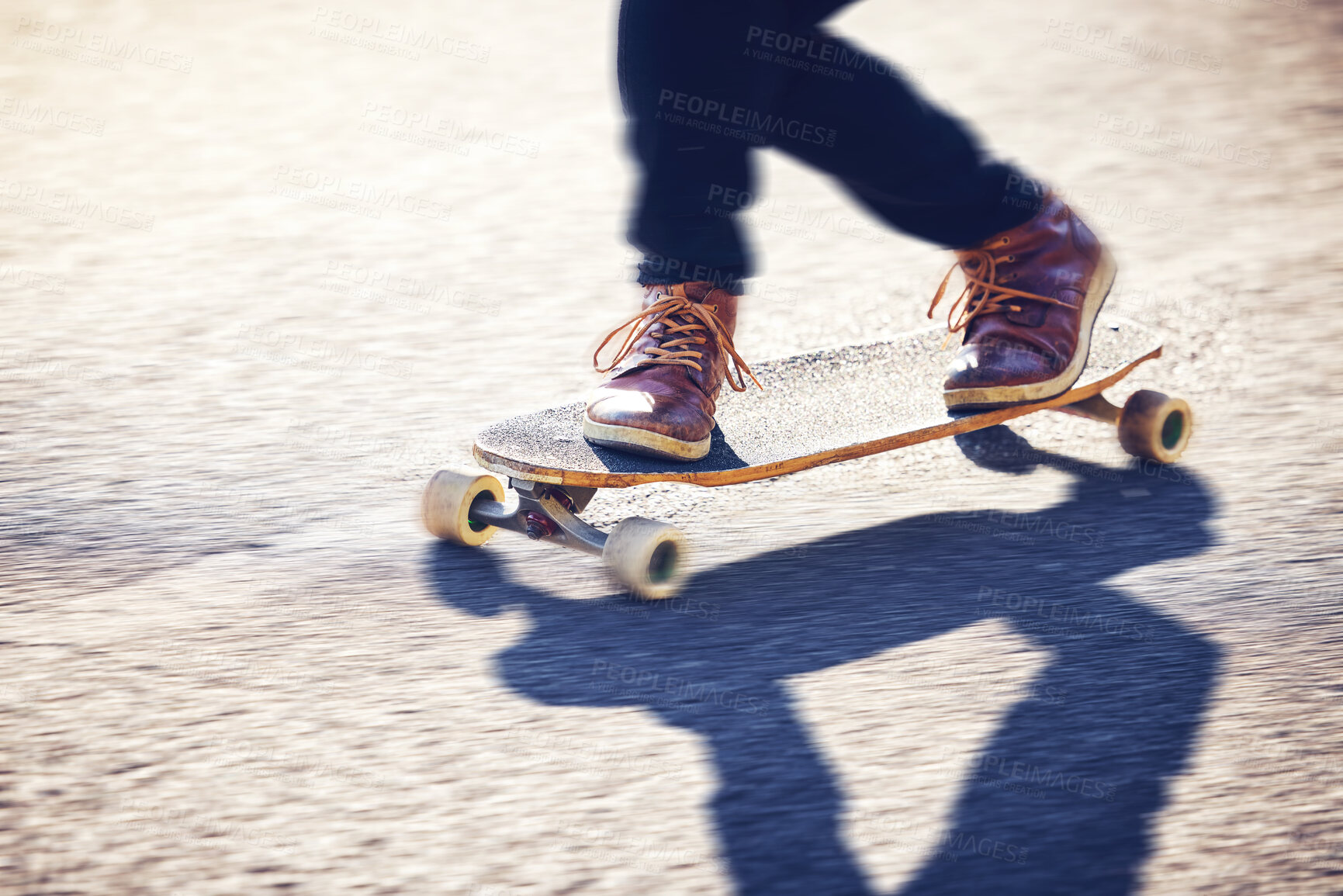 Buy stock photo Feet, skateboard and man skating on road for fitness, exercise and wellness. Training sports, shoes and legs of male skater on board, skateboarding or riding outdoors for balance or workout on street