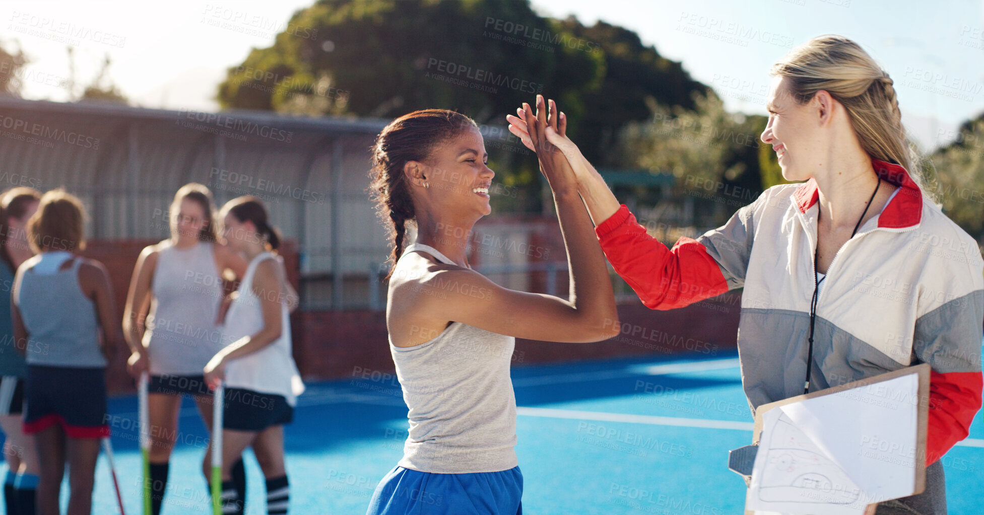 Buy stock photo Sports, high five and girl with coach for celebration, motivation and team building for hockey players. Fitness, training and woman coaching girls for match, game practice and competition on court