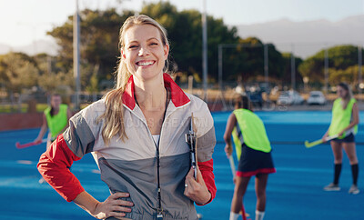 Buy stock photo Hockey, coach and portrait of woman at stadium for training, fitness and cardio with group, happy and excited. Sports, trainer and female smile, confident and cheerful during game, match and sport