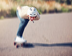 Skateboard, blurred motion and speed with a sports man skating on an asphalt road outdoor for recreation. Skate, soft focus and fast with a male athlete or skater training outside on the street