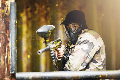 Buy stock photo Paintball, war and camouflage with a sports man playing a military game for fun or training outdoor. Gun, soldier and target with a male athlete shooting a weapon outside during an army exercise